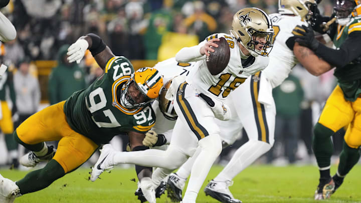 Dec 23, 2024; Green Bay, Wisconsin, USA; New Orleans Saints quarterback Spencer Rattler (18) rushes with the football during the first quarter against the Green Bay Packers at Lambeau Field. Mandatory Credit: Jeff Hanisch-Imagn Images Dec 23, 2024; Green Bay, Wisconsin, USA; New Orleans Saints quarterback Spencer Rattler (18) rushes with the football during the first quarter against the Green Bay Packers at Lambeau Field. Mandatory Credit: Jeff Hanisch-Imagn Images