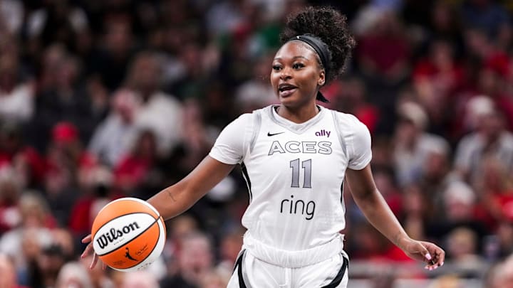 Las Vegas Aces guard Dana Evans (11) brings the ball up the court Thursday, July 3, 2025, during a game between the Indiana Fever and the Las Vegas Aces at Gainbridge Fieldhouse in Indianapolis. Las Vegas Aces guard Dana Evans (11) brings the ball up the court Thursday, July 3, 2025, during a game between the Indiana Fever and the Las Vegas Aces at Gainbridge Fieldhouse in Indianapolis.