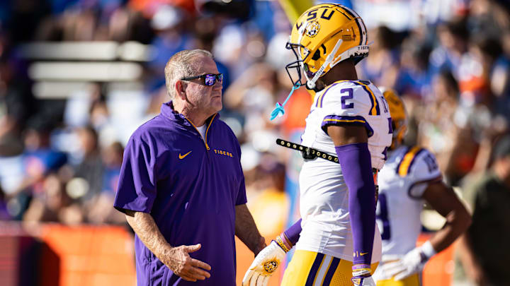 Nov 16, 2024; Gainesville, Florida, USA; LSU Tigers head coach Brian Kelly talks with LSU Tigers wide receiver Kyren Lacy (2) before a game against the Florida Gators at Ben Hill Griffin Stadium. Mandatory Credit: Matt Pendleton-Imagn Images Nov 16, 2024; Gainesville, Florida, USA; LSU Tigers head coach Brian Kelly talks with LSU Tigers wide receiver Kyren Lacy (2) before a game against the Florida Gators at Ben Hill Griffin Stadium. Mandatory Credit: Matt Pendleton-Imagn Images
