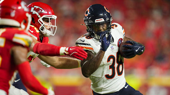Aug 22, 2025; Kansas City, Missouri, USA; Chicago Bears running back Brittain Brown (38) runs the ball against Kansas City Chiefs linebacker Cooper McDonald (59) at GEHA Field at Arrowhead Stadium. Mandatory Credit: Jay Biggerstaff-Imagn Images