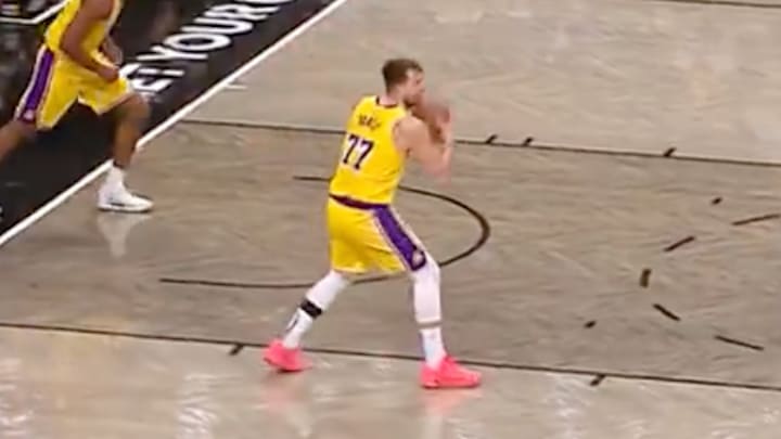 Doncic preparing to throw a full-court pass. 