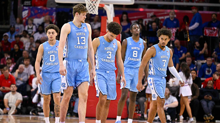Jan 3, 2026; Dallas, Texas, USA; North Carolina Tar Heels guard Kyan Evans (0) and center Henri Veesaar (13) and guard Derek Dixon (3) and forward Caleb Wilson (8) and guard Seth Trimble (7) come back on the court during the second half against the SMU Mustangs at Moody Coliseum. Mandatory Credit: Jerome Miron-Imagn Images Jan 3, 2026; Dallas, Texas, USA; North Carolina Tar Heels guard Kyan Evans (0) and center Henri Veesaar (13) and guard Derek Dixon (3) and forward Caleb Wilson (8) and guard Seth Trimble (7) come back on the court during the second half against the SMU Mustangs at Moody Coliseum. Mandatory Credit: Jerome Miron-Imagn Images