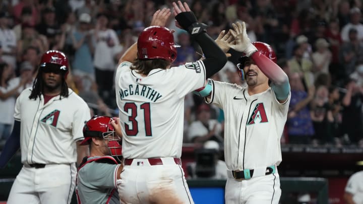 Arizona Diamondbacks outfielder Corbin Carroll (7) celebrates with outfielder Jake McCarthy.