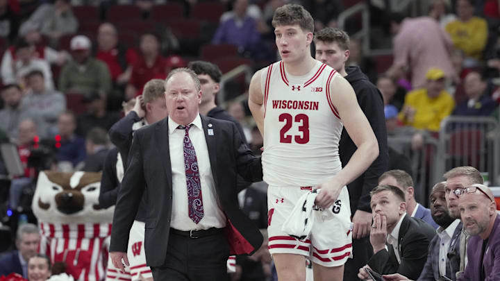 Wisconsin Badgers head coach Greg Gard is shown with forward Will Garlock. 