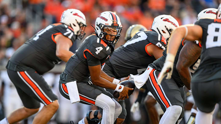 Sep 21, 2024; Corvallis, Oregon, USA; Oregon State Beavers quarterback Gevani McCoy (4) takes the snap during the first half against the Purdue Boilermakers at Reser Stadium. Mandatory Credit: Craig Strobeck-Imagn Images Sep 21, 2024; Corvallis, Oregon, USA; Oregon State Beavers quarterback Gevani McCoy (4) takes the snap during the first half against the Purdue Boilermakers at Reser Stadium. Mandatory Credit: Craig Strobeck-Imagn Images