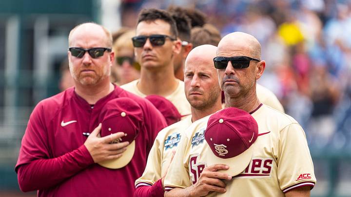 Jun 18, 2024; Omaha, NE, USA; Florida State Seminoles head coach Link Jarrett during the national anthem before the game against the North Carolina Tar Heels at Charles Schwab Field Omaha. Mandatory Credit: Dylan Widger-Imagn Images
