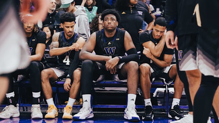 Great Osobor sits expressionless while waiting to be introduced as a starter before a Husky game. 