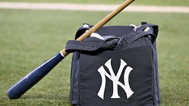 Aug 4, 2025; Arlington, Texas, USA; A view of a baseball bat and a New York Yankees bag and logo before the game between the Texas Rangers and the Yankees at Globe Life Field. Mandatory Credit: Jerome Miron-Imagn Images Aug 4, 2025; Arlington, Texas, USA; A view of a baseball bat and a New York Yankees bag and logo before the game between the Texas Rangers and the Yankees at Globe Life Field. Mandatory Credit: Jerome Miron-Imagn Images