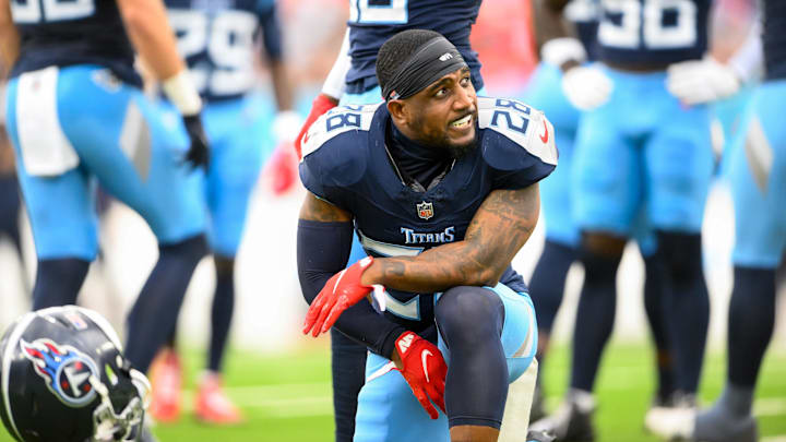 Nov 3, 2024; Nashville, Tennessee, USA;  Tennessee Titans safety Quandre Diggs (28) slams his helmet down after an ankle injury against the New England Patriots during the first half at Nissan Stadium.