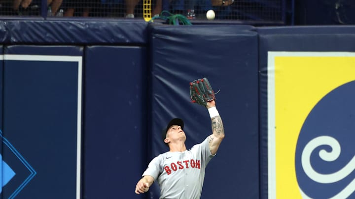 Sep 17, 2024; St. Petersburg, Florida, USA; Boston Red Sox outfielder Tyler O'Neill (17) catches a fly ball during the second inning against the Tampa Bay Rays at Tropicana Field. Mandatory Credit: Kim Klement Neitzel-Imagn Images Sep 17, 2024; St. Petersburg, Florida, USA; Boston Red Sox outfielder Tyler O'Neill (17) catches a fly ball during the second inning against the Tampa Bay Rays at Tropicana Field. Mandatory Credit: Kim Klement Neitzel-Imagn Images