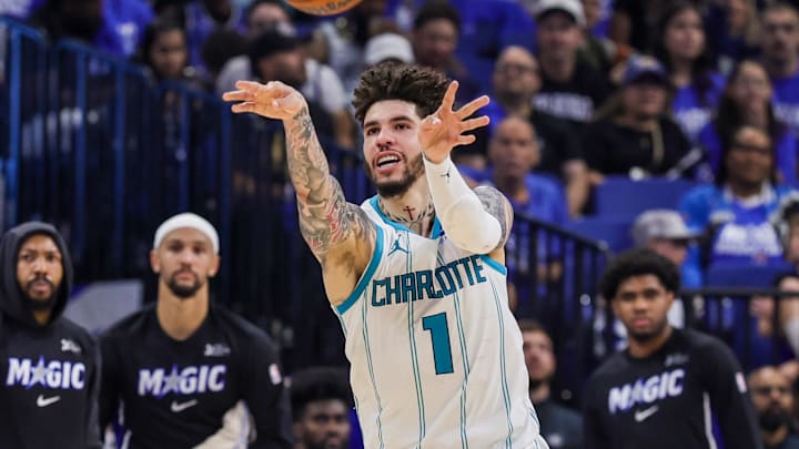 Apr 17, 2026; Orlando, Florida, USA; Charlotte Hornets guard LaMelo Ball (1) passes the ball during the second half against the Orlando Magic during the play-in rounds of the 2026 NBA Playoffs at Kia Center. Mandatory Credit: Mike Watters-Imagn Images