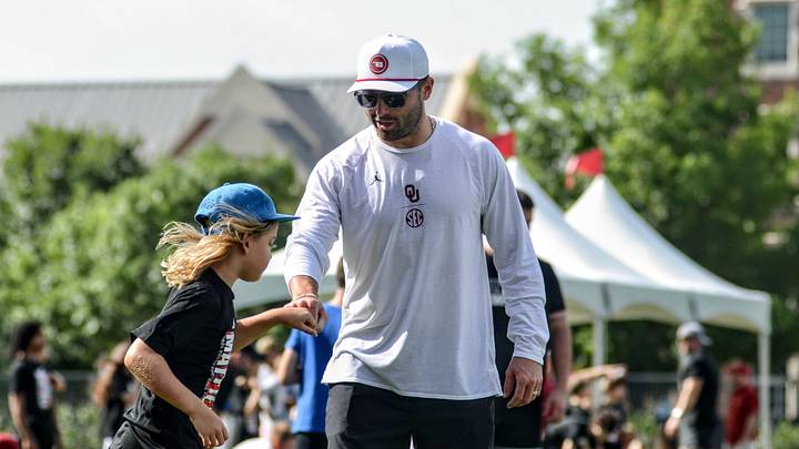 Former Oklahoma quarterback Baker Mayfield fist bumps a kid at his youth camp in Norman. Former Oklahoma quarterback Baker Mayfield fist bumps a kid at his youth camp in Norman.