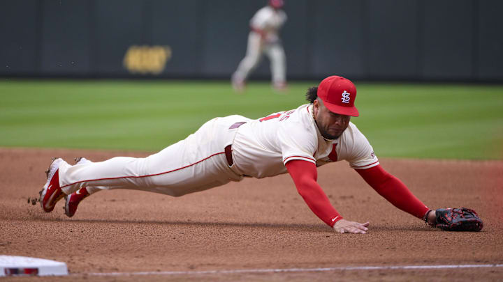 Mar 29, 2025; St. Louis, Missouri, USA;  St. Louis Cardinals first baseman Willson Contreras (40) dives and fields a ground ball hit by Minnesota Twins third baseman Jose Miranda (not pictured) during the fifth inning at Busch Stadium. Mandatory Credit: Jeff Curry-Imagn Images