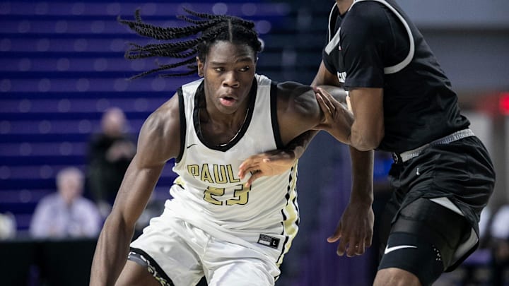 Jordan Smith Jr. of Paul VI Catholic High School drives toward the basket against Millennium High School in the City of Palms Classic on Monday, Dec. 18, 2023, at Suncoast Credit Union Arena in Fort Myers. Jordan Smith Jr. of Paul VI Catholic High School drives toward the basket against Millennium High School in the City of Palms Classic on Monday, Dec. 18, 2023, at Suncoast Credit Union Arena in Fort Myers.