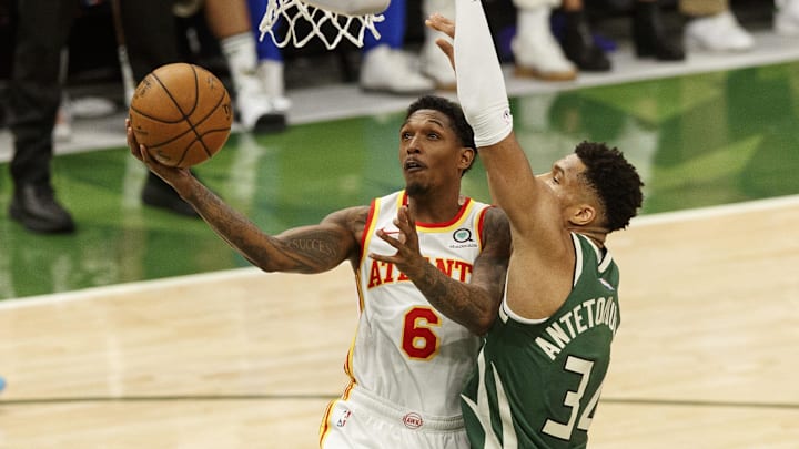 Jun 23, 2021; Milwaukee, Wisconsin, USA; Atlanta Hawks guard Lou Williams (6) drives for the basket against Milwaukee Bucks forward Giannis Antetokounmpo (34) during the fourth quarter during game one of the Eastern Conference Finals for the 2021 NBA Playoffs at Fiserv Forum. Mandatory Credit: Jeff Hanisch-Imagn Images