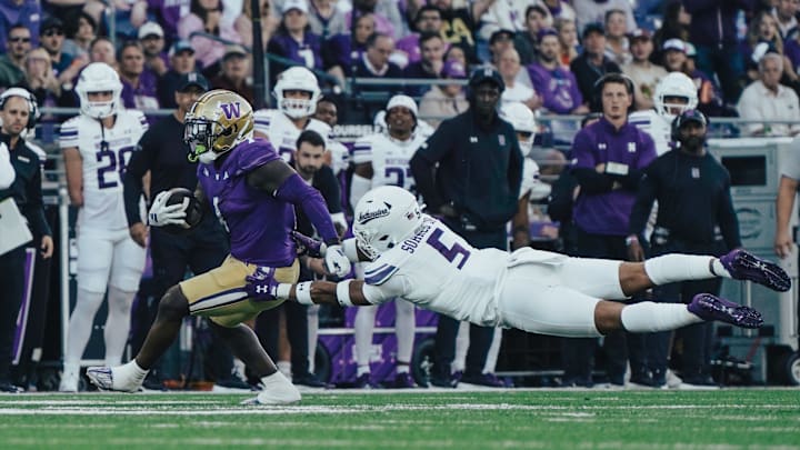 Jonah Coleman breaks a tackle against Northwestern. 