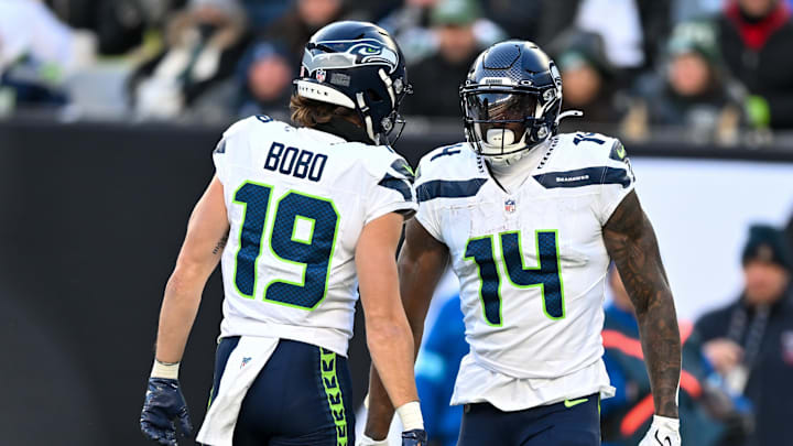 Dec 1, 2024; East Rutherford, New Jersey, USA; Seattle Seahawks wide receiver DK Metcalf (14) celebrates a first down catch with wide receiver Jake Bobo (19) during the third quarter at MetLife Stadium. Dec 1, 2024; East Rutherford, New Jersey, USA; Seattle Seahawks wide receiver DK Metcalf (14) celebrates a first down catch with wide receiver Jake Bobo (19) during the third quarter at MetLife Stadium.