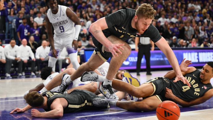 Purdue Boilermakers forward Caleb Furst (1) dives for the loose ball Purdue Boilermakers forward Caleb Furst (1) dives for the loose ball