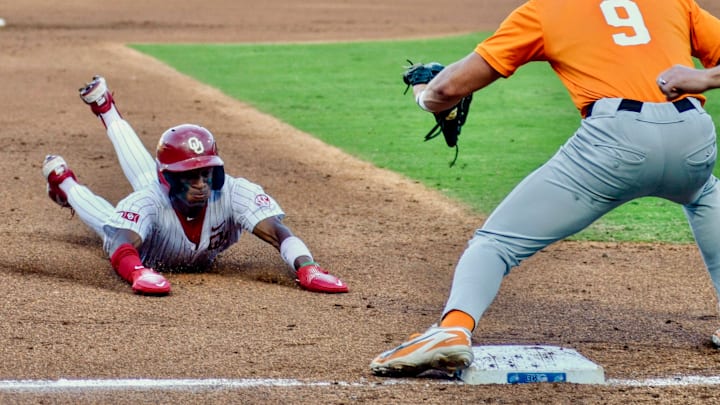 Dasan Harris slides into third base.
