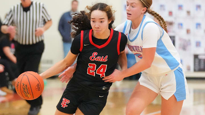 Wauwatosa East's Mikaia Litza (24) drives past Arrowhead's Presly Samz (5) during a non-conference game between state powerhouses on Jan. 27, 2026. 