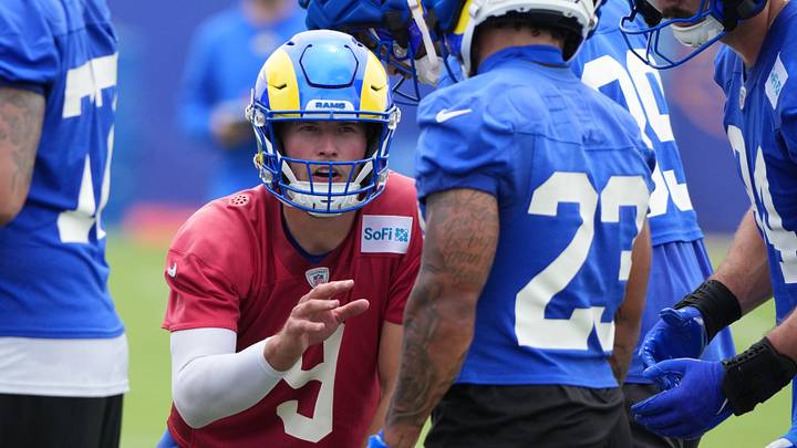 May 28, 2025; Woodland Hills, CA, USA; Los Angeles Rams quarterback Matt Stafford (9) gives the play to running back Karen Williams (23) in the huddle during organized team activities at Rams Practice Facility. Mandatory Credit: Kirby Lee-Imagn Images May 28, 2025; Woodland Hills, CA, USA; Los Angeles Rams quarterback Matt Stafford (9) gives the play to running back Karen Williams (23) in the huddle during organized team activities at Rams Practice Facility. Mandatory Credit: Kirby Lee-Imagn Images