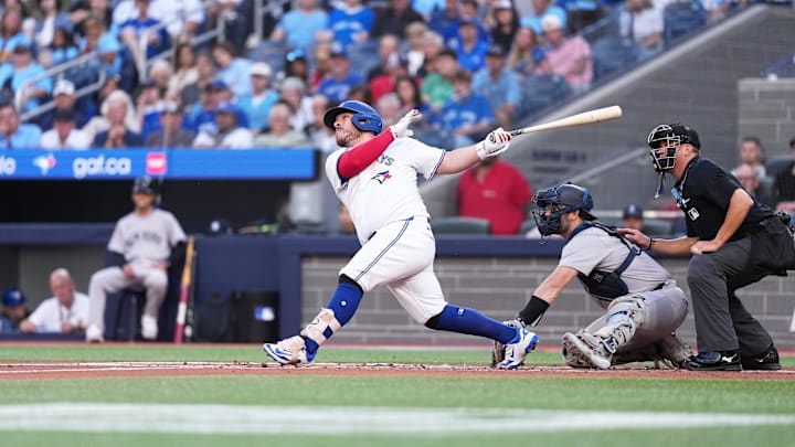 Jul 21, 2025; Toronto, Ontario, CAN; Toronto Blue Jays catcher Alejandro Kirk (30) hits a double against the New York Yankees during the second inning at Rogers Centre.