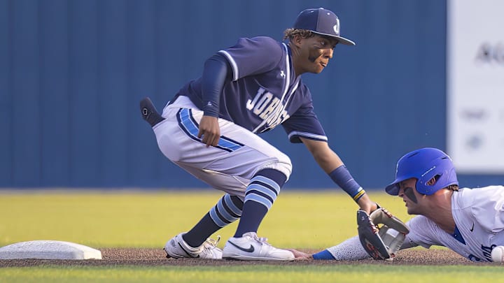 Westlake Chaparrals Blake Peterson (2) slides into 2nd base ahead of the tag from SA Johnson Jaguars Kayson Cunningham (6) at the UIL Regional IV Final 6A  baseball Round 1 playoff on Thursday, June 1, 2023, at Westlake High School in West Lake Hills, TX.