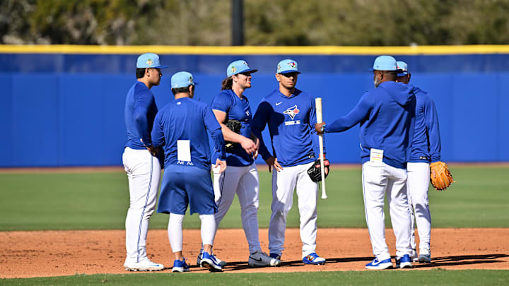Feb 17, 2026; Dunedin, FL, USA;  Members of the Toronto Blue Jays  prepare for a drill during spring training at Bobby Mattick Training Center at Englebert Complex. Mandatory Credit: Jonathan Dyer-Imagn Images