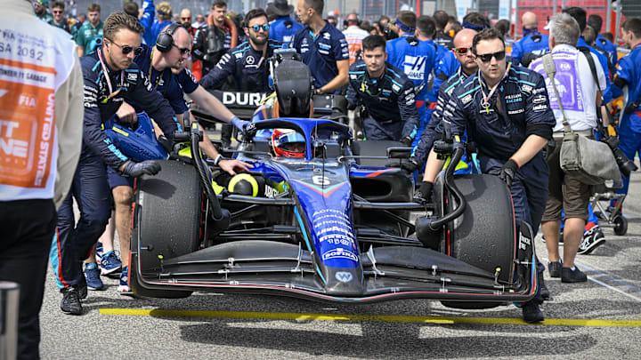 Oct 23, 2022; Austin, Texas, USA; The crew of Williams Racing driver Nicholas Latifi (6) of Team Canada wheel their car onto the grid before the start of the U.S. Grand Prix F1 race at Circuit of the Americas. Mandatory Credit: Jerome Miron-USA TODAY Sports