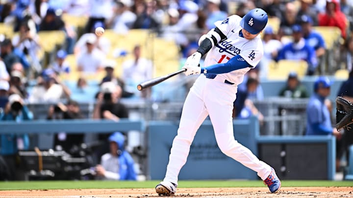 Apr 12, 2026; Los Angeles, California, USA;  Los Angeles Dodgers two-way player Shohei Ohtani (17) hits a solo homerun during the first inning against the Texas Rangers at Dodger Stadium. Mandatory Credit: Jonathan Hui-Imagn Images