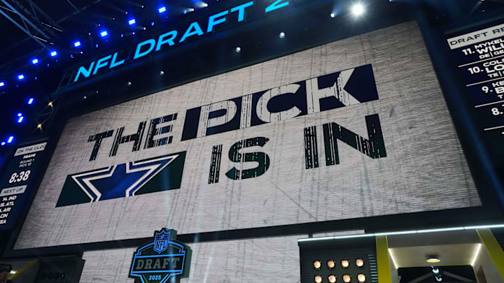 The Dallas Cowboys logo is projected on the video board during the NFL Draft at Lambeau Field. The Dallas Cowboys logo is projected on the video board during the NFL Draft at Lambeau Field.
