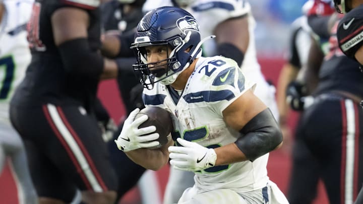 Dec 8, 2024; Glendale, Arizona, USA; Seattle Seahawks running back Zach Charbonnet (26) against the Arizona Cardinals at State Farm Stadium. Mandatory Credit: Mark J. Rebilas-Imagn Images Dec 8, 2024; Glendale, Arizona, USA; Seattle Seahawks running back Zach Charbonnet (26) against the Arizona Cardinals at State Farm Stadium. Mandatory Credit: Mark J. Rebilas-Imagn Images