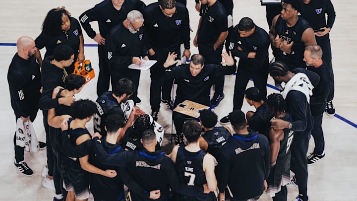 Danny Sprinkle gives his UW team its marching orders during a timeout. 