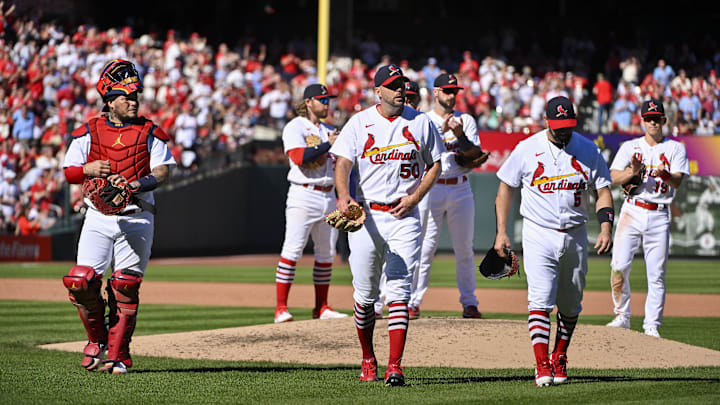 Oct 2, 2022; St. Louis, Missouri, USA; St. Louis Cardinals catcher Yadier Molina (4) starting pitcher Adam Wainwright (50) and first baseman Albert Pujols (5) walk off the field together after all three were removed from the game during the fifth inning against the Pittsburgh Pirates at Busch Stadium. Mandatory Credit: Jeff Curry-Imagn Images Oct 2, 2022; St. Louis, Missouri, USA; St. Louis Cardinals catcher Yadier Molina (4) starting pitcher Adam Wainwright (50) and first baseman Albert Pujols (5) walk off the field together after all three were removed from the game during the fifth inning against the Pittsburgh Pirates at Busch Stadium. Mandatory Credit: Jeff Curry-Imagn Images