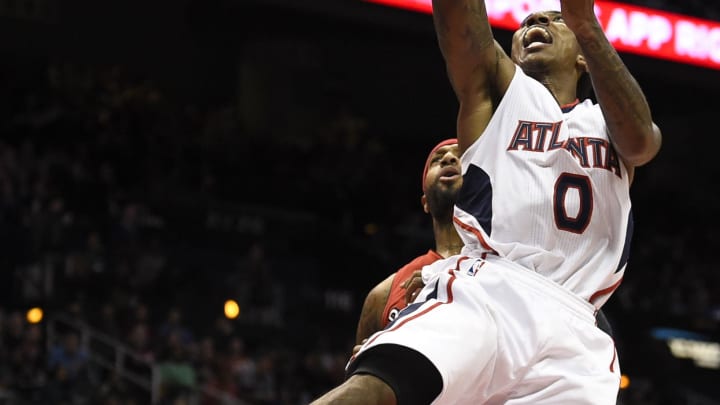 Nov 26, 2014; Atlanta, GA, USA; Atlanta Hawks guard Jeff Teague (0) shoots the ball in front of Toronto Raptors forward James Johnson (3) during the second half at Philips Arena. The Raptors won 126-115. Mandatory Credit: Dale Zanine-USA TODAY Sports Nov 26, 2014; Atlanta, GA, USA; Atlanta Hawks guard Jeff Teague (0) shoots the ball in front of Toronto Raptors forward James Johnson (3) during the second half at Philips Arena. The Raptors won 126-115. Mandatory Credit: Dale Zanine-USA TODAY Sports