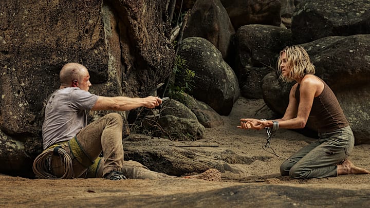 (L-R) Taron Egerton as Ben and Charlize Theron as Sasha in Apex