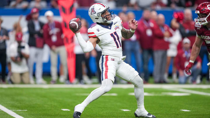 Dec 28, 2023; San Antonio, TX, USA;  Arizona Wildcats quarterback Noah Fifita (11) throws a pass in the first half against the Oklahoma Sooners at Alamodome. 