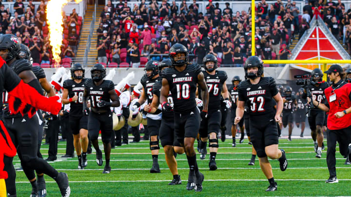 Louisville players running onto the field of L&N Stadium during pregame. Louisville players running onto the field of L&N Stadium during pregame.