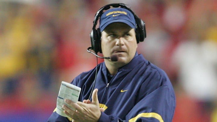 Jan 2, 2006: Atlanta, GA, USA: West Virginia Mountaineers head coach Rich Rodriguez claps after a touchdown in the second quarter of the Nokia Sugar Bowl against the Georgia Bulldogs at the Georgia Dome. Mandatory Credit: Photo By Christopher Gooley-Imagn Images Copyright (c) 2006 Christopher Gooley