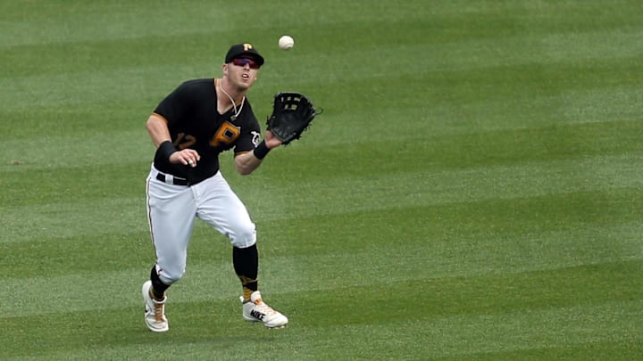 Jul 14, 2018; Pittsburgh, PA, USA;  Pittsburgh Pirates left fielder Corey Dickerson (12) makes a catch against the Milwaukee Brewers during the third inning at PNC Park. Mandatory Credit: Charles LeClaire-Imagn Images