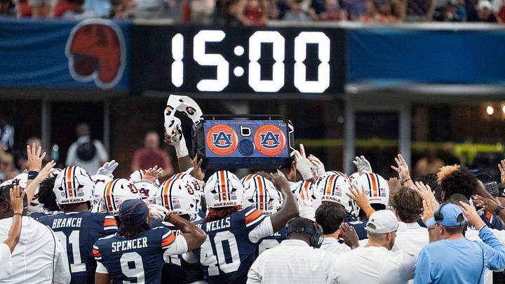 Auburn Tigers players huddle up at the start of the fourth quarter as Auburn Tigers take on Baylor Bears in the Aflac Kickoff Game at Mercedes-Benz Stadium in Atlanta, Ga.