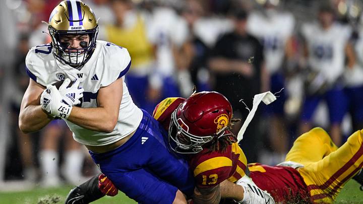 Husky tight end Jack Westover is tackled by USC linebacker Mason Cobb (13) in the 2023 game in Los Angeles. Husky tight end Jack Westover is tackled by USC linebacker Mason Cobb (13) in the 2023 game in Los Angeles.
