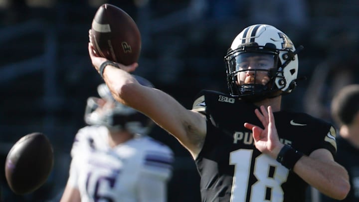 Purdue Boilermakers quarterback Bennett Meredith (18) throws the ball Purdue Boilermakers quarterback Bennett Meredith (18) throws the ball