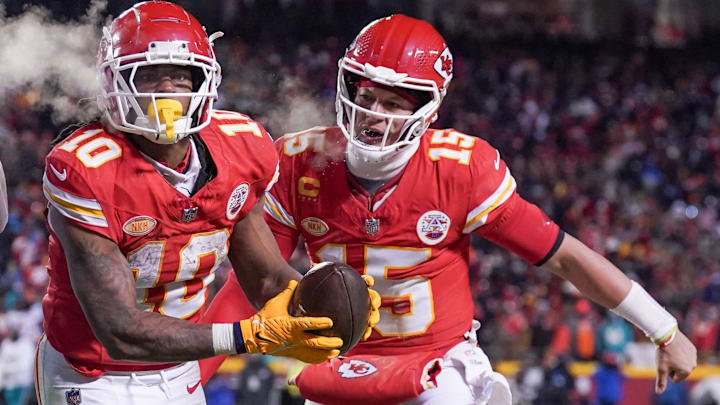 Jan 13, 2024; Kansas City, Missouri, USA; Kansas City Chiefs running back Isiah Pacheco (10) celebrates with quarterback Patrick Mahomes (15) after Pacheco scores against the Miami Dolphins in a 2024 AFC wild card game at GEHA Field at Arrowhead Stadium. Mandatory Credit: Denny Medley-Imagn Images