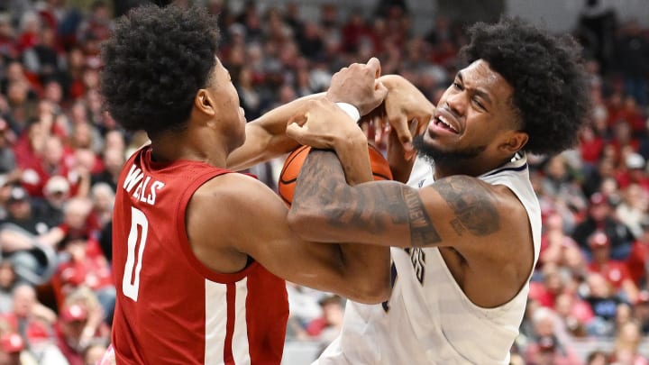 Washington's Keion Brooks Jr. (1) gets fouled by Washington State's Jaylen Wells (0) in their game in Pullman in March. 