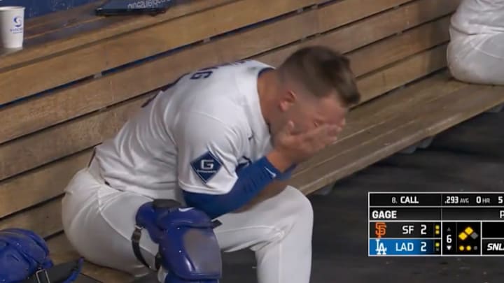 Dalton Rushing screaming into his hands after a strikeout. 