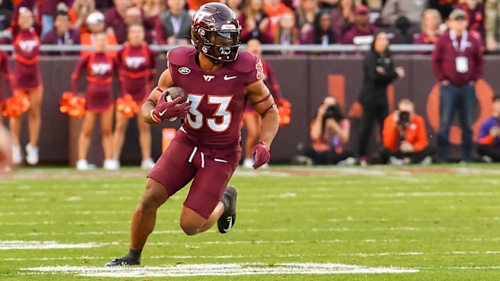 Nov 9, 2024; Blacksburg, Virginia, USA; Virginia Tech Hokies running back Bhayshul Tuten (33) runs after a catch against the Clemson Tigers at Lane Stadium. Nov 9, 2024; Blacksburg, Virginia, USA; Virginia Tech Hokies running back Bhayshul Tuten (33) runs after a catch against the Clemson Tigers at Lane Stadium.