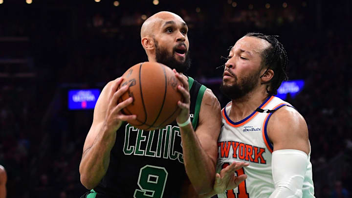 May 14, 2025; Boston, Massachusetts, USA; Boston Celtics guard Derrick White (9) drives to the basket while New York Knicks guard Jalen Brunson (11) defends in the second half during game five of the second round for the 2025 NBA Playoffs at TD Garden. Mandatory Credit: Bob DeChiara-Imagn Images