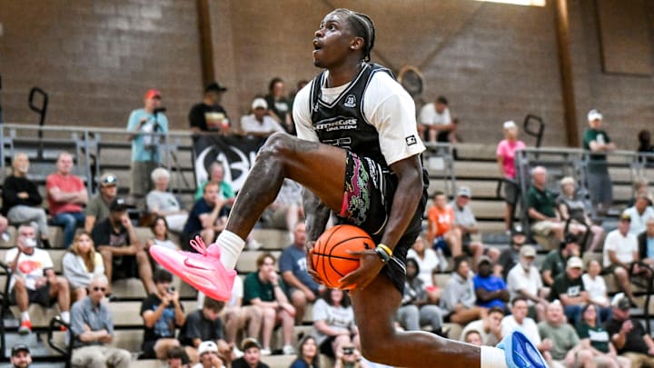 Team Motorcars and Michigan State's Coen Carr dunks against Team Fargo during the Moneyball Pro-Am on Tuesday, June 24, 2025, at Holt High School.