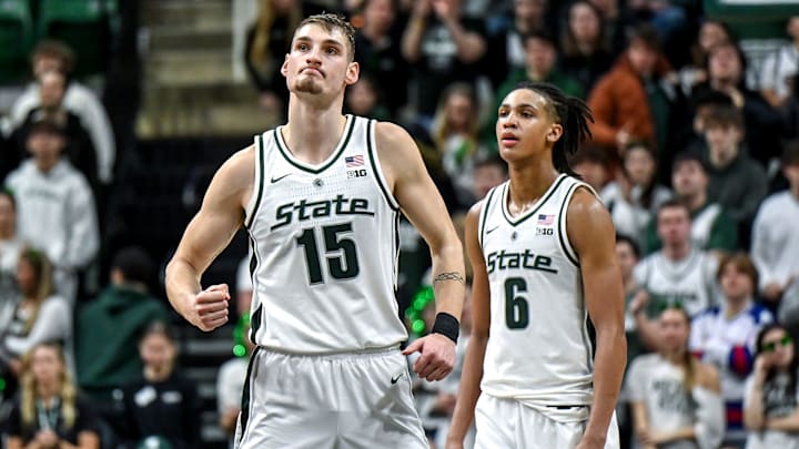 Michigan State's Carson Cooper, left, pumps his fist after time runs out in the Spartans win over Ohio State on Sunday, Feb. 22, 2026, at the Breslin Center in East Lansing. At right is teammate Jordan Scott.